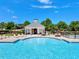 Community pool featuring a cabana and lounge seating, perfect for enjoying sunny days by the sparkling water at 5404 Onyx Mill Ct, Raleigh, NC 27616