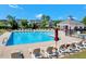 Resort-style community pool with lounge chairs and shaded areas, perfect for relaxing and enjoying sunny days at 5404 Onyx Mill Ct, Raleigh, NC 27616