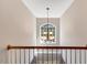 Elegant foyer with chandelier and large arched window providing ample natural light at 5404 Onyx Mill Ct, Raleigh, NC 27616