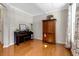 Cozy room features hardwood floors, large windows, and built-in cabinet, perfect for relaxation at 5404 Onyx Mill Ct, Raleigh, NC 27616