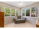 Bright sunroom with many windows offering natural light and comfortable seating at 5404 Onyx Mill Ct, Raleigh, NC 27616