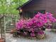 Inviting home exterior featuring an trellis, lush azalea bushes and gravel, creating a picturesque entrance at 5604 Hideaway Dr, Chapel Hill, NC 27516