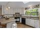 Bright eat-in kitchen with skylight and plenty of natural light at 5604 Hideaway Dr, Chapel Hill, NC 27516