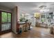 Open concept living room shows kitchen, skylights, wood floors and breakfast bar at 5604 Hideaway Dr, Chapel Hill, NC 27516