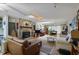 Inviting living room with stone fireplace, hardwood floors, and abundant natural light at 5604 Hideaway Dr, Chapel Hill, NC 27516