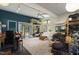 Open living room with a lofted space above, a piano, and a cozy seating area with a large rug at 5604 Hideaway Dr, Chapel Hill, NC 27516