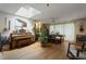 Bright living room with hardwood floors, skylight, and eclectic decor at 5604 Hideaway Dr, Chapel Hill, NC 27516