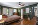 Spacious main bedroom with beautiful hardwood floors and direct access to ensuite bathroom at 5604 Hideaway Dr, Chapel Hill, NC 27516