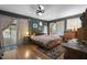 Spacious main bedroom with beautiful hardwood floors and plenty of natural light at 5604 Hideaway Dr, Chapel Hill, NC 27516