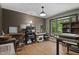Home office with hardwood floors, large windows and natural light at 5604 Hideaway Dr, Chapel Hill, NC 27516
