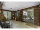 Bright sunroom with tile flooring, natural wood accents, and ample natural light at 5604 Hideaway Dr, Chapel Hill, NC 27516