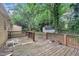 Wooden deck overlooking a sprawling, green backyard with mature trees and vegetation at 5804 Heatherbrook Cir, Raleigh, NC 27612