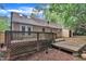 Exterior view of backyard showing deck, home, and storage building at 5804 Heatherbrook Cir, Raleigh, NC 27612