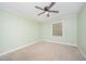 Bedroom with neutral carpet, a ceiling fan, and a window for natural light at 5804 Heatherbrook Cir, Raleigh, NC 27612