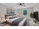 Inviting bedroom featuring soft lighting, contemporary decor, and a view of the backyard at 5804 Heatherbrook Cir, Raleigh, NC 27612