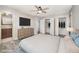 Serene bedroom featuring closet space, a ceiling fan, and a view to an ensuite bathroom at 5804 Heatherbrook Cir, Raleigh, NC 27612