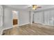 Bedroom featuring new wood floors and a doorway to a bathroom and closet at 5804 Heatherbrook Cir, Raleigh, NC 27612