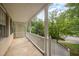 Relaxing covered porch featuring a neutral color scheme, lattice detail and a lovely view of the surrounding landscape at 5804 Heatherbrook Cir, Raleigh, NC 27612