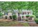 Charming single-story home featuring a welcoming front porch, brick foundation, and tidy landscaping at 5804 Heatherbrook Cir, Raleigh, NC 27612