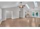 Spacious living room with an open layout, vaulted ceilings, and hardwood floors at 5804 Heatherbrook Cir, Raleigh, NC 27612