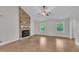 Inviting living room featuring hardwood floors and a brick fireplace at 5804 Heatherbrook Cir, Raleigh, NC 27612