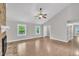 Open concept living room boasts hardwood floors and plenty of natural light at 5804 Heatherbrook Cir, Raleigh, NC 27612