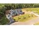 Aerial view of a home with an expansive lawn, complemented by a charming stone facade at 60 Stream View Way, Spring Hope, NC 27882