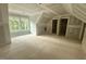 Unfinished attic featuring dormer windows offering natural light and openings to closets and storage at 60 Stream View Way, Spring Hope, NC 27882