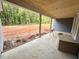 View of the back porch which has a serene view of the backyard and surrounding trees at 60 Stream View Way, Spring Hope, NC 27882