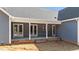 Covered back porch featuring doors, offering an outdoor area for relaxation and entertainment at 60 Stream View Way, Spring Hope, NC 27882