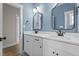 Bathroom features a double vanity, undermount sinks, and framed mirrors, creating a stylish space at 60 Stream View Way, Spring Hope, NC 27882