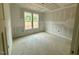Bright, unfinished bedroom with natural light from two large windows at 60 Stream View Way, Spring Hope, NC 27882