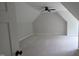 Upper bedroom with a ceiling fan features neutral walls and an angled ceiling at 60 Stream View Way, Spring Hope, NC 27882