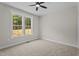 Bright bedroom with two windows and neutral carpet, creating a cozy and inviting space at 60 Stream View Way, Spring Hope, NC 27882