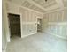 Unfinished bedroom featuring a walk-in closet, trim work, and primed walls ready for paint at 60 Stream View Way, Spring Hope, NC 27882