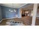 Dining area adjacent to the kitchen with modern lighting fixtures and open layout at 60 Stream View Way, Spring Hope, NC 27882