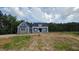 Charming two-story home with a combination of blue siding for a timeless, classic exterior at 60 Stream View Way, Spring Hope, NC 27882