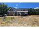 View of a newly built home, featuring gray siding, a charming dormer, and a front porch at 60 Stream View Way, Spring Hope, NC 27882