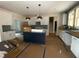 Modern kitchen featuring white cabinets, a central island, and stylish pendant lighting, perfect for cooking at 60 Stream View Way, Spring Hope, NC 27882