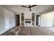 Living room features a ceiling fan, fireplace, and access to covered porch at 60 Stream View Way, Spring Hope, NC 27882