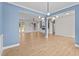 Bright and spacious living room featuring wood floors, stylish lighting, and an open layout for entertaining at 60 Stream View Way, Spring Hope, NC 27882