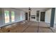 Living room with fireplace, built-ins, ceiling fan, and french doors to outdoors at 60 Stream View Way, Spring Hope, NC 27882