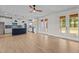 Open-concept living room showcases a kitchen and French doors to the outdoor area at 60 Stream View Way, Spring Hope, NC 27882
