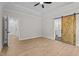 Main bedroom showcases a sliding barn door to the bathroom and bright windows at 60 Stream View Way, Spring Hope, NC 27882