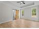 Main bedroom with a sliding barn door leading to the bathroom and two windows at 60 Stream View Way, Spring Hope, NC 27882