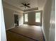 Serene main bedroom with trey ceilings, complemented by natural light from dual windows, creating a relaxing space at 60 Stream View Way, Spring Hope, NC 27882