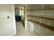 Unfinished pantry featuring open shelving connecting the kitchen and main room at 60 Stream View Way, Spring Hope, NC 27882