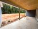 New home construction shows a covered patio with raw backyard, offering a great space for outdoor living at 60 Stream View Way, Spring Hope, NC 27882