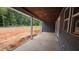 Covered outdoor patio with gray siding and a view of the backyard at 60 Stream View Way, Spring Hope, NC 27882