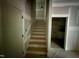 Unfinished staircase primed and ready for paint leading to unfinished rooms at 60 Stream View Way, Spring Hope, NC 27882